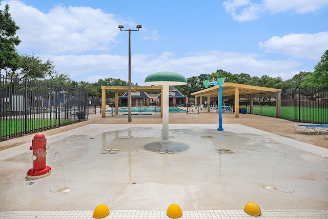 2025 Reef Dr, League City, TX 77573 - view of jungle gym with a community pool and fence