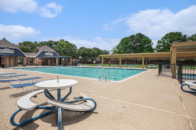 2025 Reef Dr, League City, TX 77573 - community pool featuring fence and a patio area