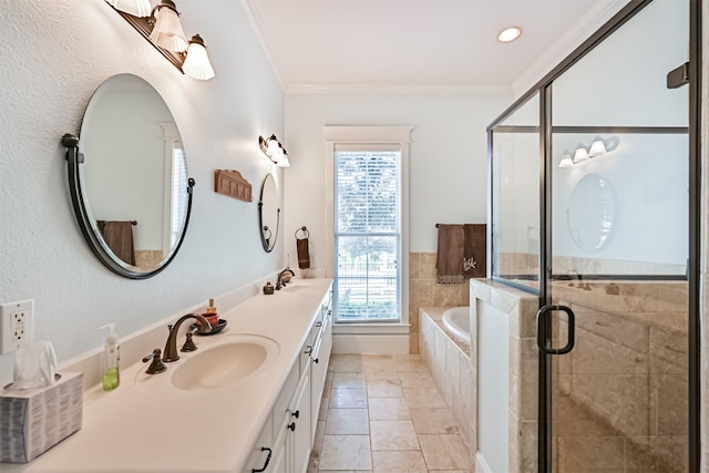 bathroom featuring a garden tub, a sink, a wealth of natural light, and a shower stall