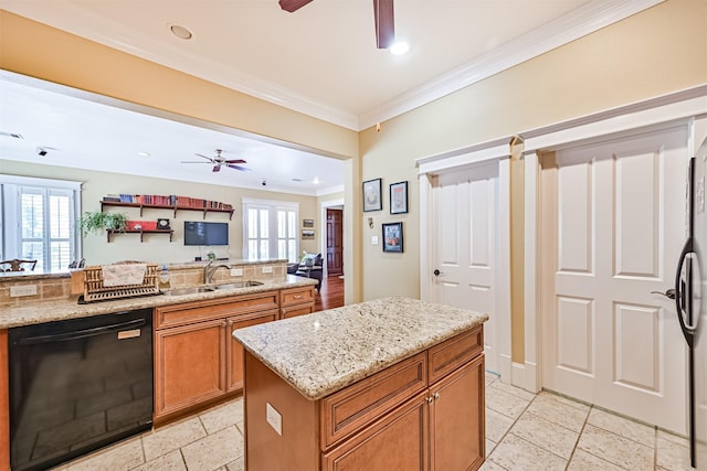 kitchen with a sink, ceiling fan, brown cabinets, and dishwasher