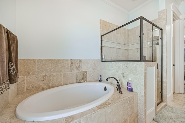 bathroom featuring ornamental molding, a shower stall, and a bath