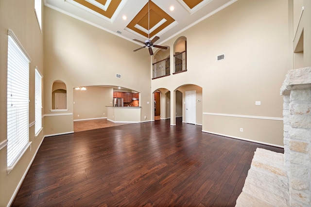 11014 Via Capri Ct, Richmond, TX 77406 - unfurnished living room with ceiling fan, dark wood-type flooring, a high ceiling, baseboards, and coffered ceiling