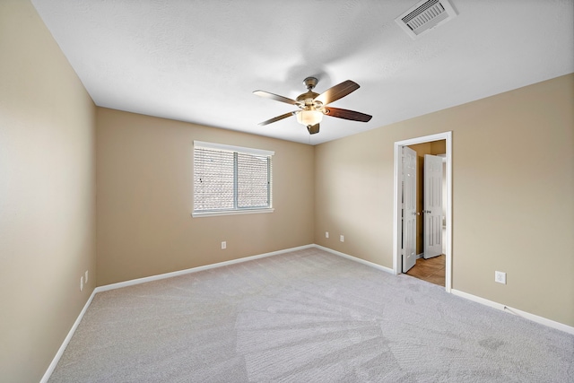 11014 Via Capri Ct, Richmond, TX 77406 - empty room featuring ceiling fan, light colored carpet, and baseboards