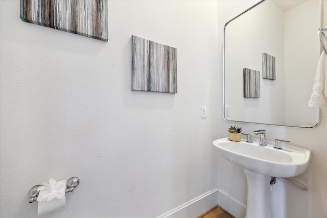 bathroom featuring baseboards
