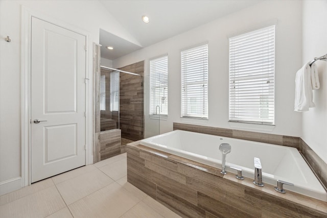 full bath featuring a tile shower, tile patterned floors, recessed lighting, vaulted ceiling, and a bath