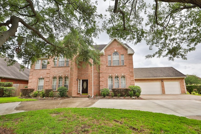view of front facade featuring concrete driveway, brick siding, a garage, and a front lawn