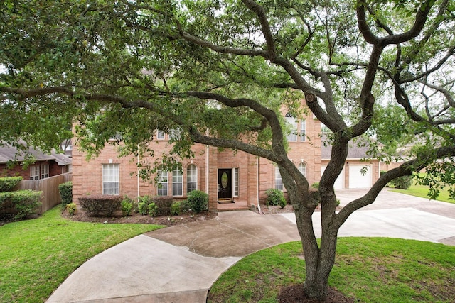12219 Renaissance Ln, Houston, TX 77071 - view of property hidden behind natural elements featuring fence, an attached garage, a front lawn, brick siding, and concrete driveway