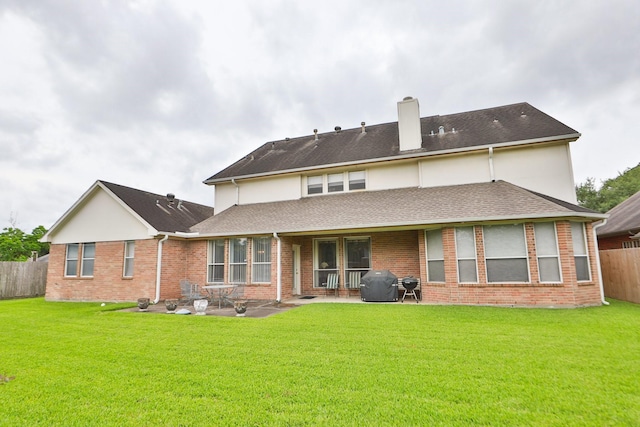 12219 Renaissance Ln, Houston, TX 77071 - back of house featuring fence, a patio, a chimney, and a lawn