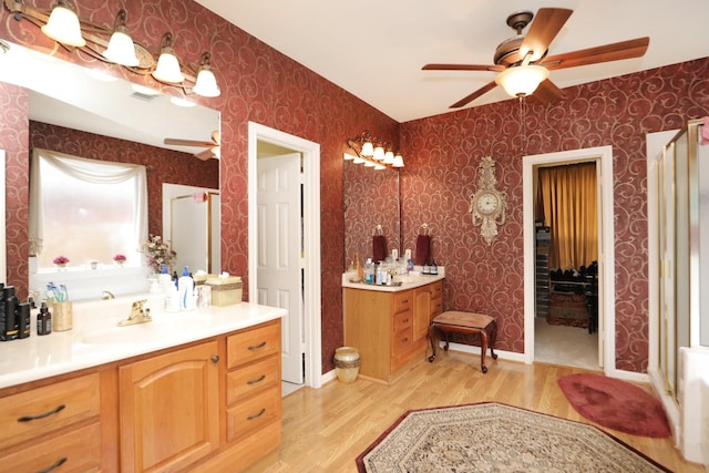 12219 Renaissance Ln, Houston, TX 77071 - full bath with a stall shower, ceiling fan, wood finished floors, and wallpapered walls