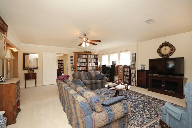 12219 Renaissance Ln, Houston, TX 77071 - living area featuring crown molding, a ceiling fan, light colored carpet, and visible vents