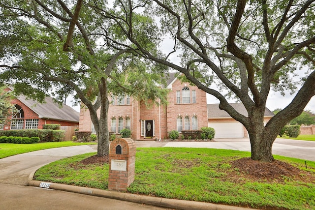 12219 Renaissance Ln, Houston, TX 77071 - traditional home with brick siding, a garage, curved driveway, and a front lawn