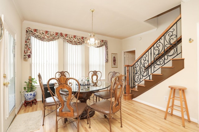 12219 Renaissance Ln, Houston, TX 77071 - dining space featuring stairway, ornamental molding, light wood-style flooring, and a notable chandelier