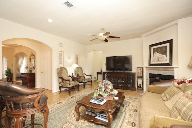 12219 Renaissance Ln, Houston, TX 77071 - living room featuring arched walkways, a ceiling fan, visible vents, and wood finished floors