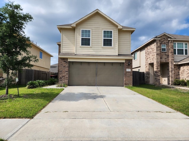 view of front of house with brick siding, a garage, and fence