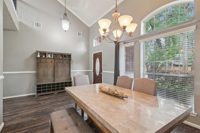 dining space with a wealth of natural light, ornamental molding, high vaulted ceiling, and visible vents