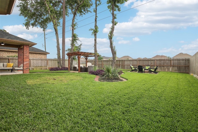 view of yard with a fenced backyard, a pergola, an outdoor living space, and a patio