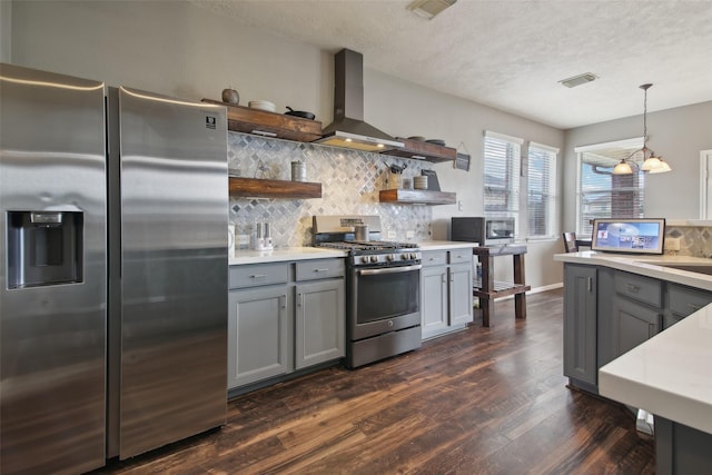 kitchen with dark wood-type flooring, open shelves, appliances with stainless steel finishes, and gray cabinetry