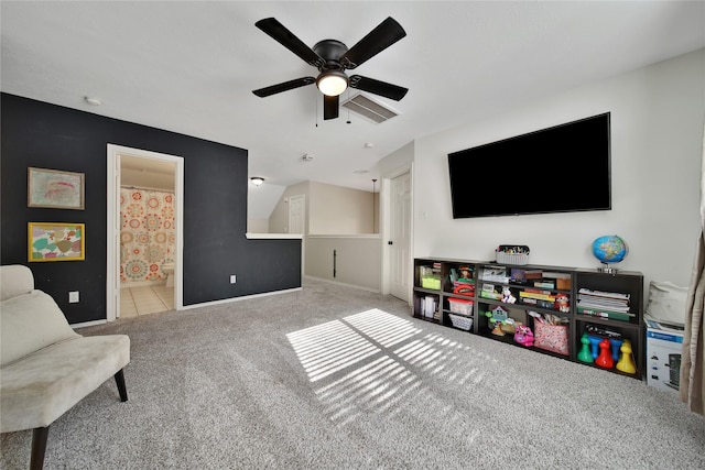 interior space with ceiling fan, baseboards, and carpet