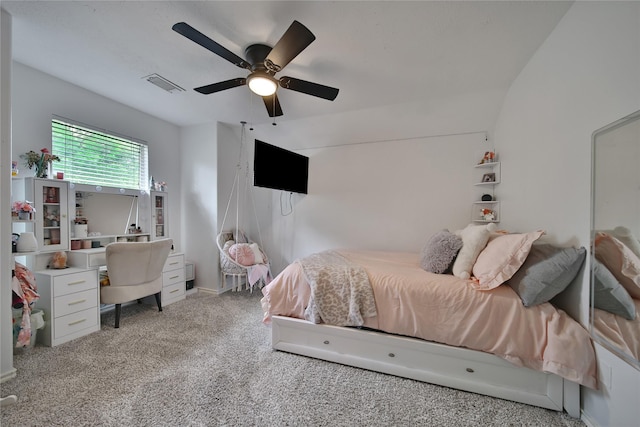 bedroom featuring a ceiling fan, light colored carpet, and visible vents