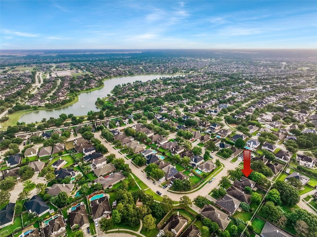 aerial view with a water view and a residential view