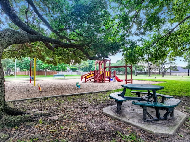 community playground with fence and a yard