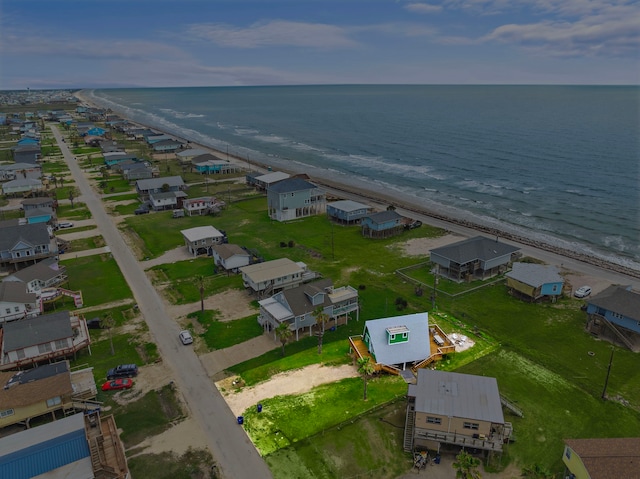 aerial view with a water view, a view of the beach, and a residential view