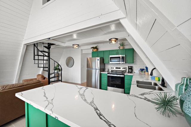 811 Seashell Dr, Surfside Beach, TX 77541 - kitchen with appliances with stainless steel finishes, a sink, decorative backsplash, green cabinetry, and beam ceiling