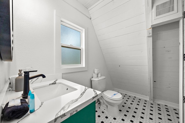 811 Seashell Dr, Surfside Beach, TX 77541 - full bathroom with vanity, toilet, and a tile shower