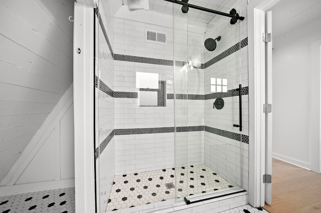 full bath with visible vents and a shower stall