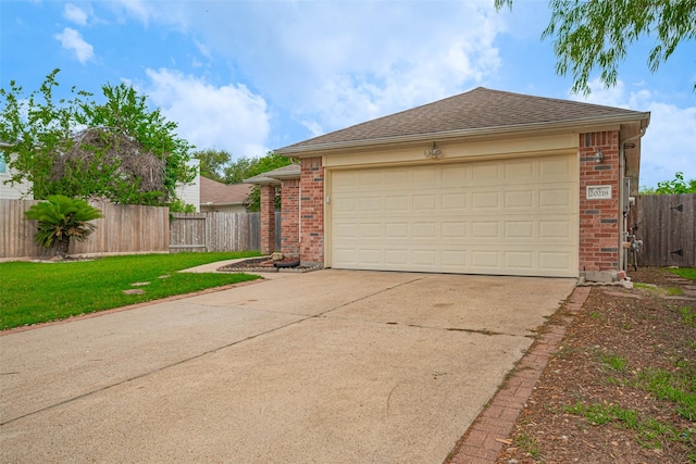 garage featuring concrete driveway and fence