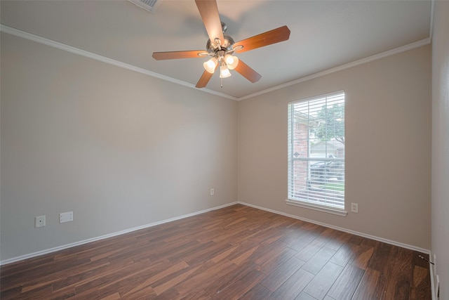 spare room with a ceiling fan, baseboards, dark wood-style floors, and ornamental molding