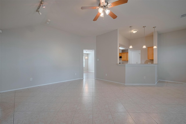 unfurnished living room with a ceiling fan, visible vents, rail lighting, baseboards, and lofted ceiling