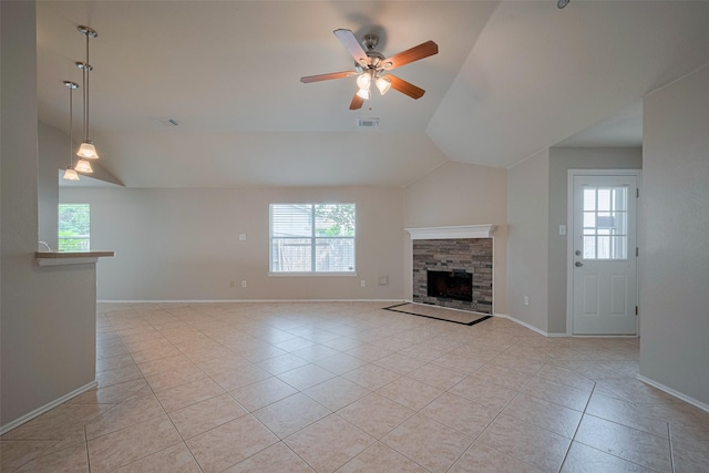 unfurnished living room featuring ceiling fan, visible vents, plenty of natural light, and light tile patterned floors