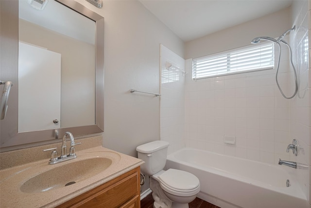bathroom with visible vents, washtub / shower combination, toilet, and vanity