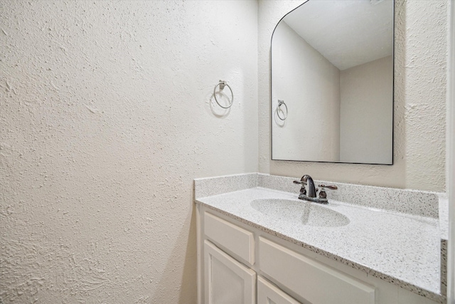 10311 Richmond Hill Dr, Houston, TX 77041 - bathroom with a textured wall and vanity