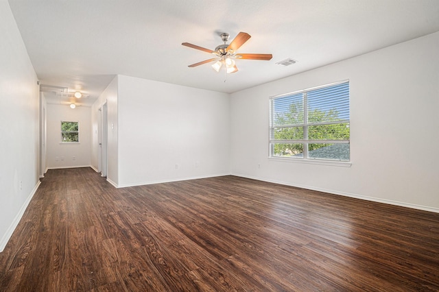 9607 Western Briar Ln, Humble, TX 77396 - unfurnished room with plenty of natural light, dark wood-type flooring, and a ceiling fan