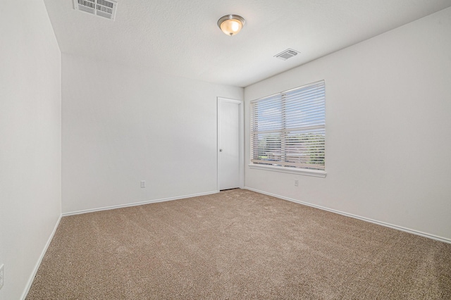 9607 Western Briar Ln, Humble, TX 77396 - spare room featuring carpet floors and baseboards