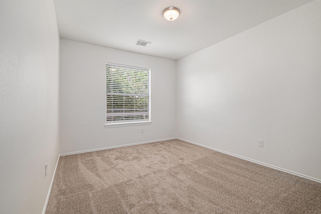 9607 Western Briar Ln, Humble, TX 77396 - spare room featuring carpet and baseboards