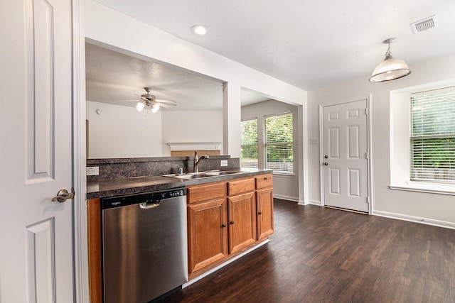 900 Summer Wood Blvd, Conroe, TX 77303 - kitchen with dishwasher, a sink, dark countertops, and dark wood finished floors