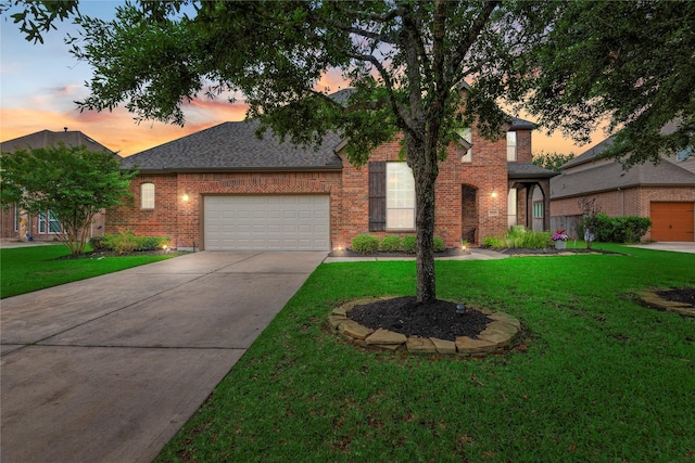 20687 Lavone Dr, Porter, TX 77365 - view of front of home with an attached garage, brick siding, concrete driveway, a lawn, and roof with shingles