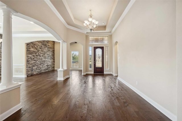 25034 Jennifer Heights Ct, Spring, TX 77389 - foyer with an inviting chandelier, arched walkways, dark wood-style flooring, and ornate columns