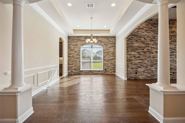 25034 Jennifer Heights Ct, Spring, TX 77389 - interior space featuring visible vents, dark wood-style flooring, a tray ceiling, arched walkways, and a notable chandelier