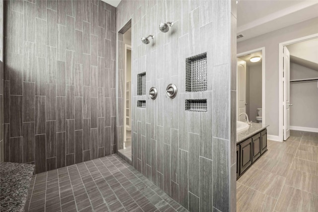 25034 Jennifer Heights Ct, Spring, TX 77389 - bathroom featuring tile patterned floors, walk in shower, and toilet