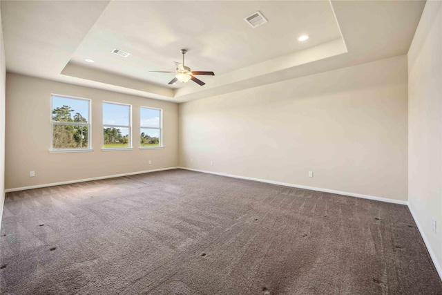 25034 Jennifer Heights Ct, Spring, TX 77389 - spare room with visible vents, carpet floors, baseboards, a tray ceiling, and a ceiling fan