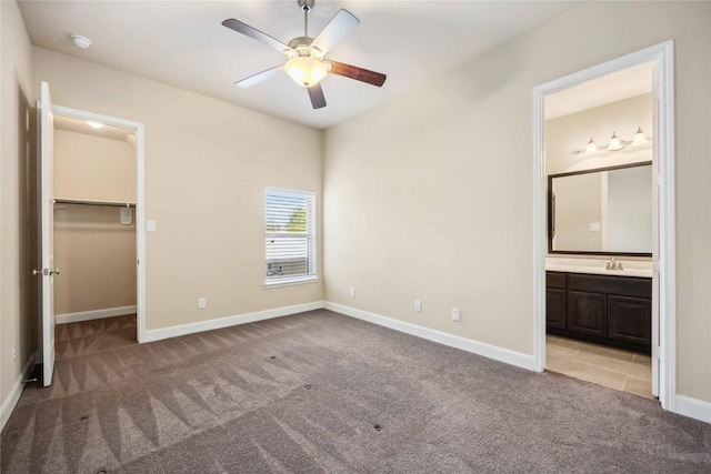 25034 Jennifer Heights Ct, Spring, TX 77389 - unfurnished bedroom featuring carpet floors, baseboards, and a spacious closet