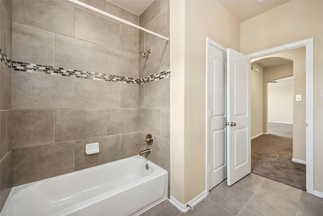 25034 Jennifer Heights Ct, Spring, TX 77389 - full bathroom featuring baseboards, bathing tub / shower combination, and tile patterned flooring