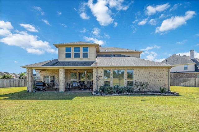 25034 Jennifer Heights Ct, Spring, TX 77389 - rear view of property with a fenced backyard, a lawn, and brick siding