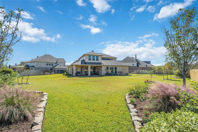 25034 Jennifer Heights Ct, Spring, TX 77389 - back of house with a patio, a fenced backyard, and a yard