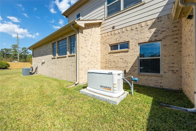 25034 Jennifer Heights Ct, Spring, TX 77389 - view of side of home with central AC unit and a yard