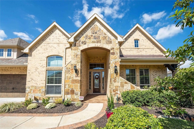 25034 Jennifer Heights Ct, Spring, TX 77389 - french country inspired facade with brick siding and stone siding